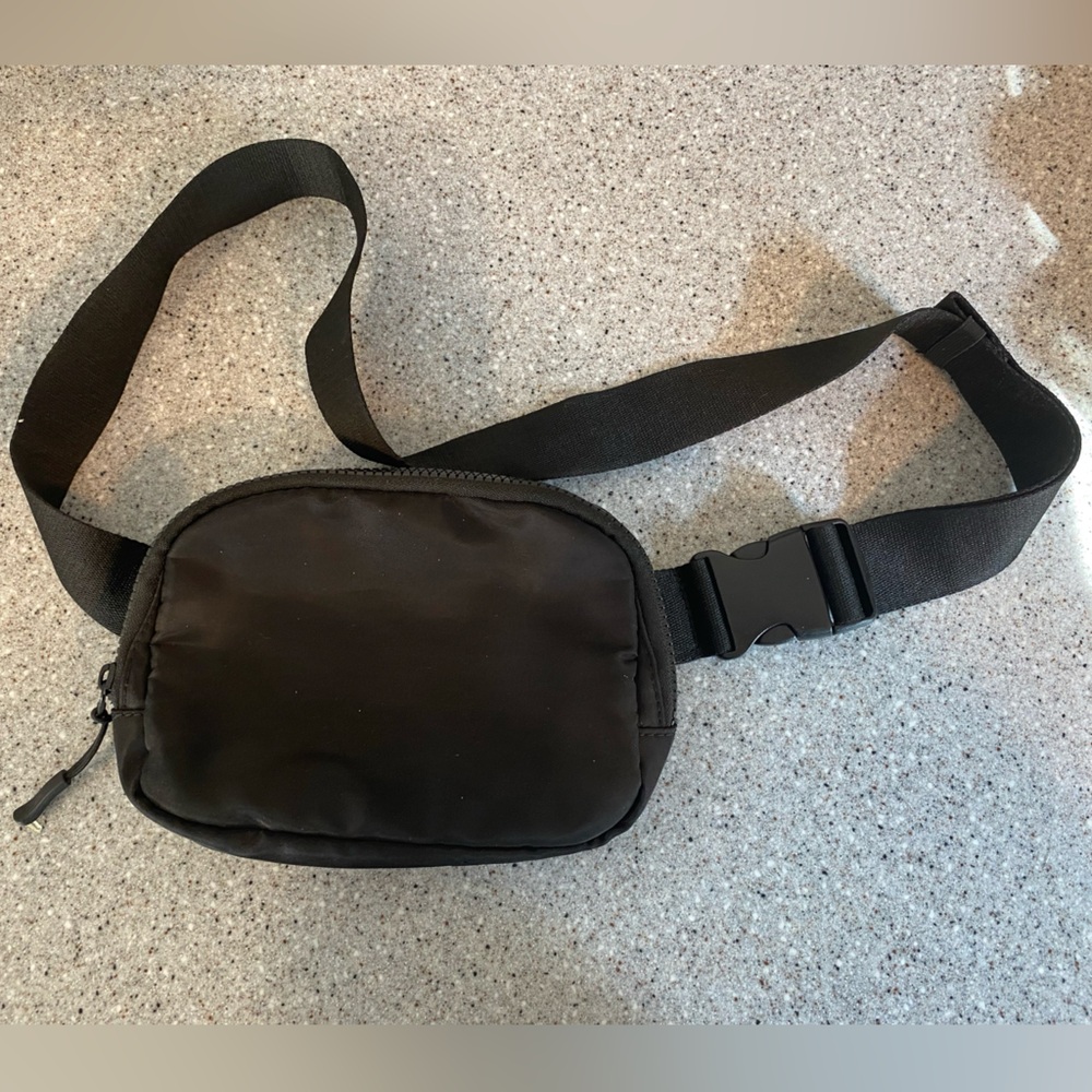 Black Maurice’s cross body bag with adjustable strap.